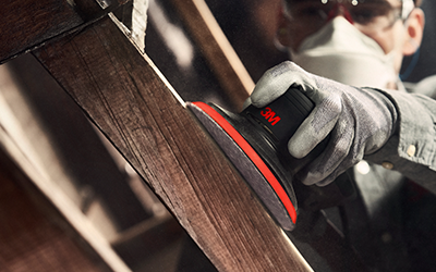 man using xtract to sand wood