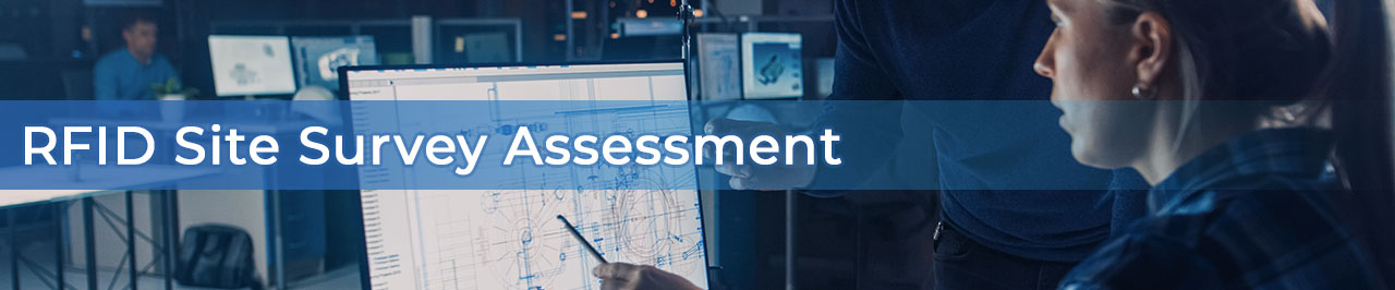 couple at computer pointing to blueprints on screen