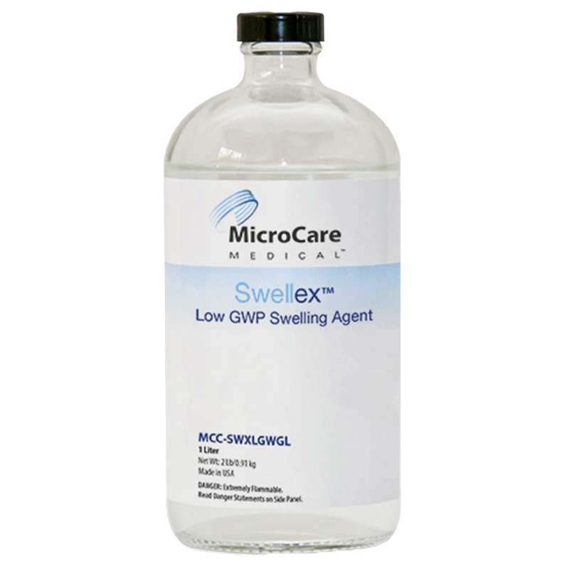 clear bottle of clear liquid with label