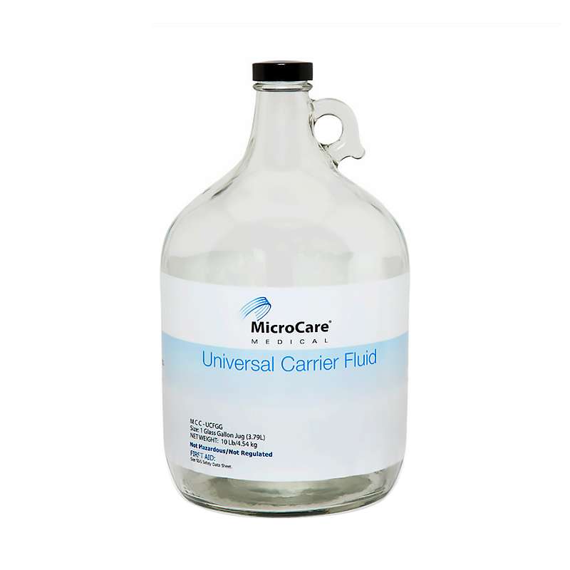 Jug, clear liquid labeled Universal Carrier Fluid