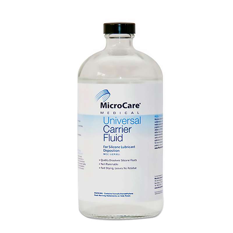 Jug, clear liquid labeled Universal Carrier Fluid